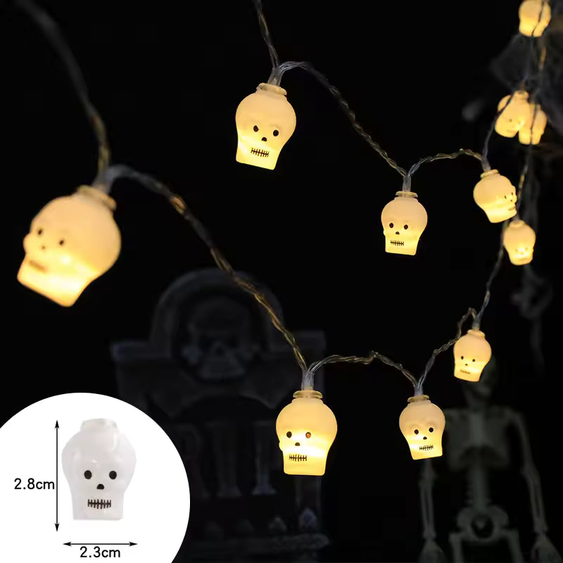 Halloween-themed string lights with skull design on a dark background