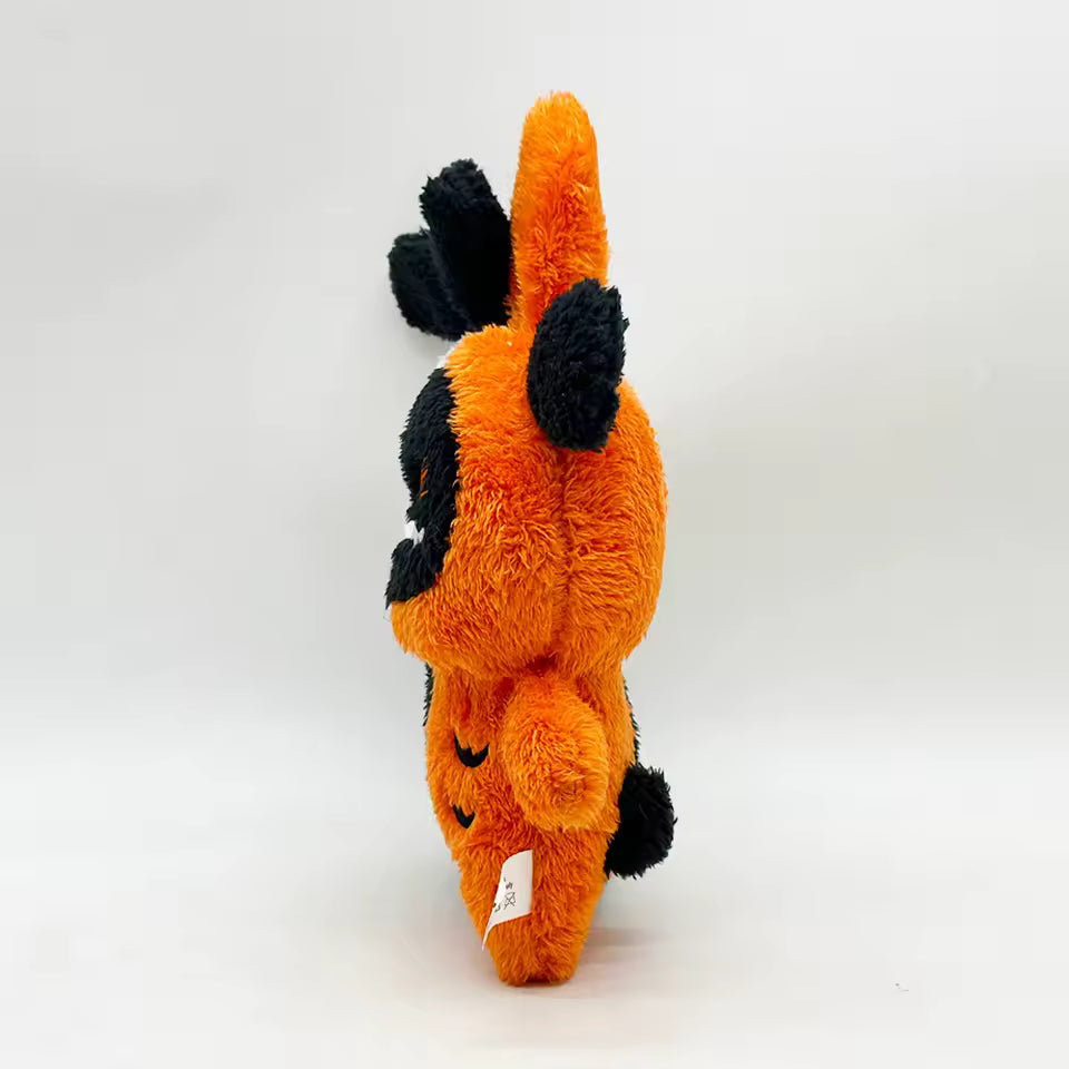 Plush toy resembling a character with orange body and black accents on a white background