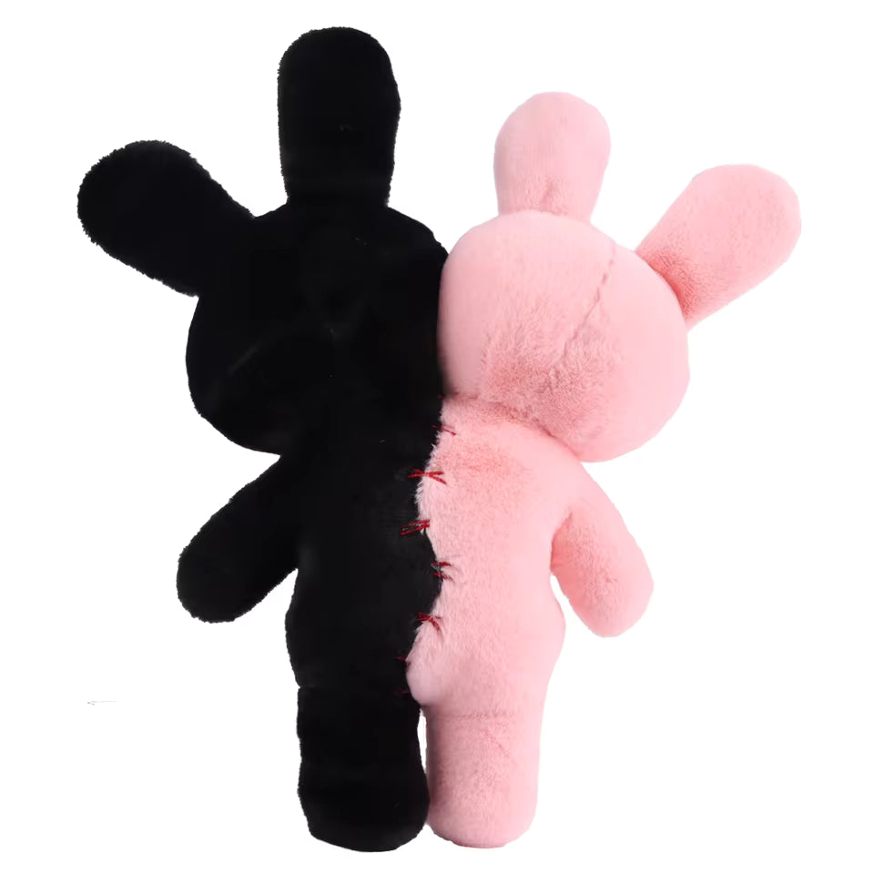 Black and pink plush toys on a white background